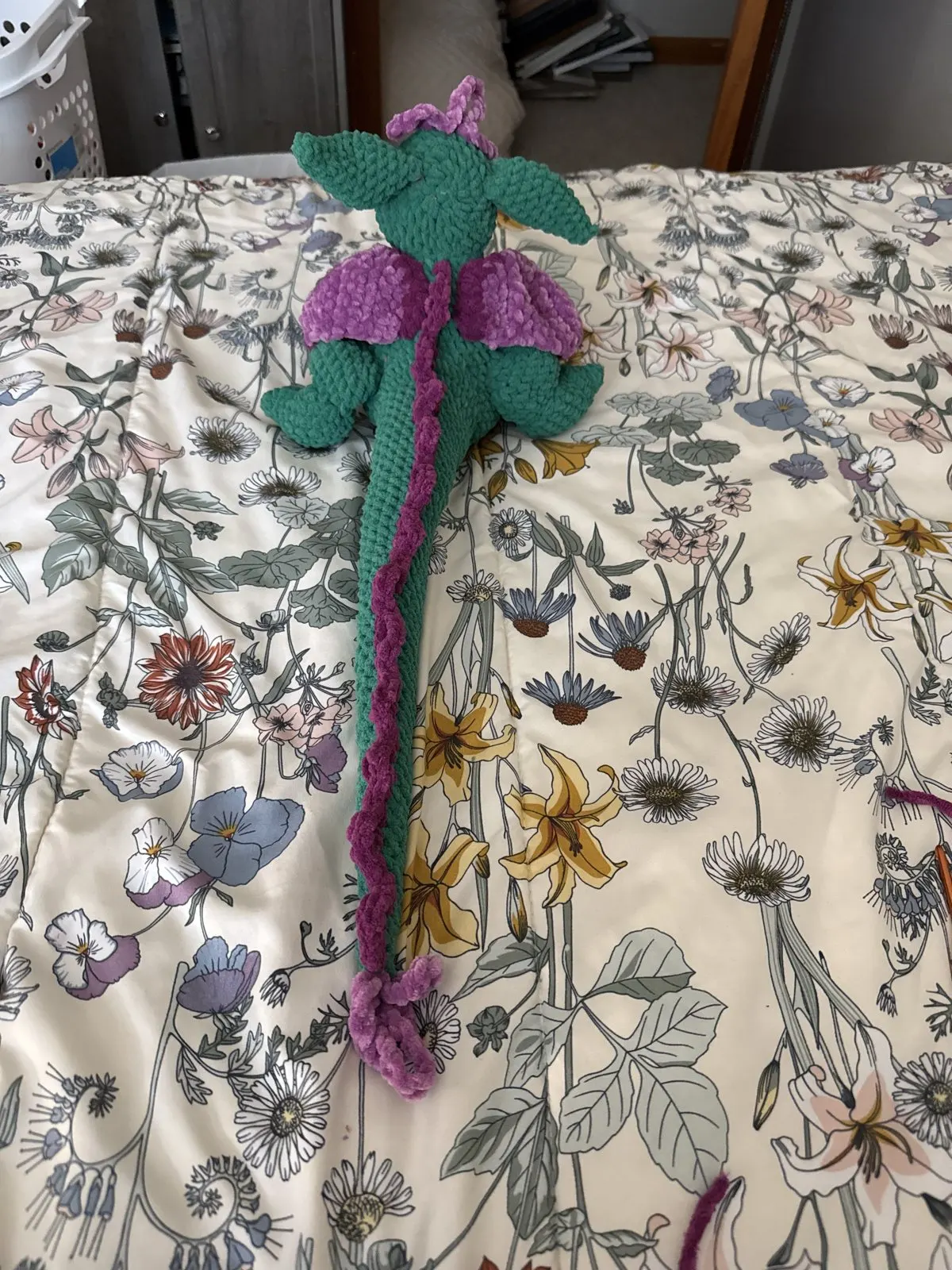 Green and purple crochet dragon
